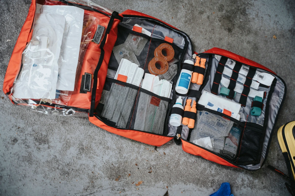 an opened first aid kit showing medical supplies